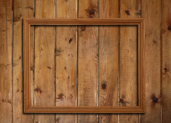 Picture frame on old wooden wall