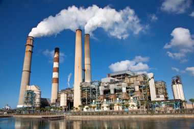 Industrial power plant with smokestack clipart