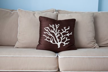 Cozy pillow on the fluffy soft sofa clipart