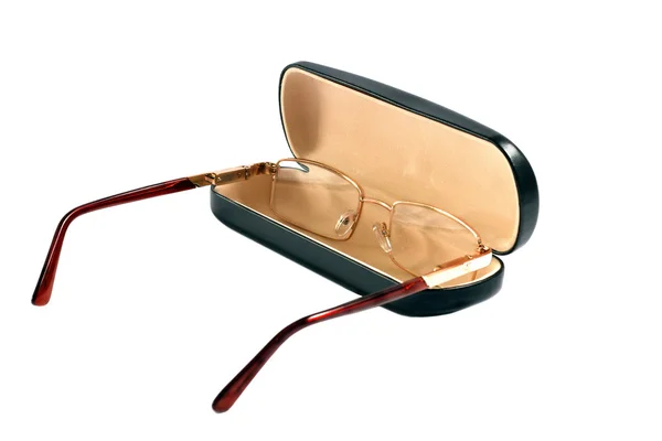 Glasses of gold color and case to them — Stock Photo, Image