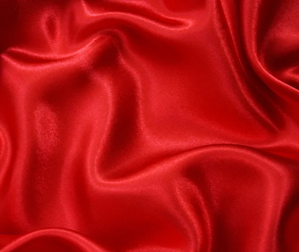 Hladké červeného hedvábí jako pozadí — Stock fotografie
