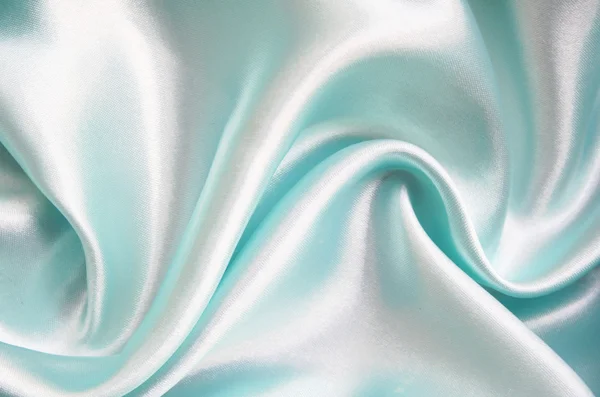 Hladké elegantní modré hedvábí jako pozadí — Stock fotografie