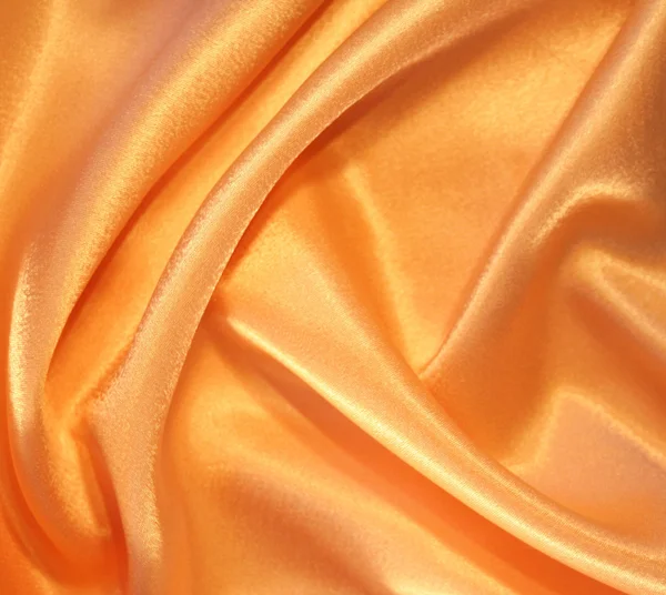 Gładkie elegancki jedwab złoty jako tło — Zdjęcie stockowe