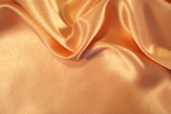 Smooth elegant golden silk background — Stock Photo, Image