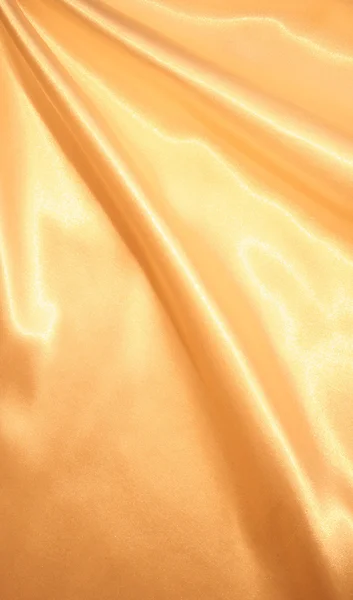 背景として滑らかなエレガントなゴールドのシルク — ストック写真