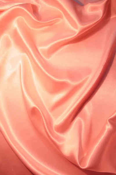 ผ้าไหมสีชมพูหรูหราเรียบเป็นพื้นหลัง — ภาพถ่ายสต็อก