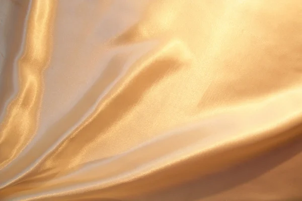 Smooth elegant gold satin as background — Stock Photo, Image