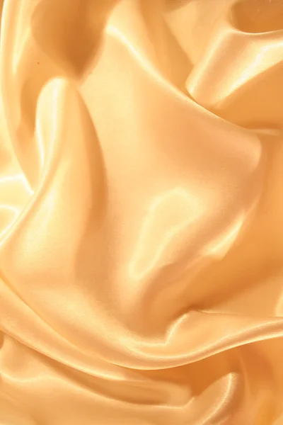 Glatte elegante goldene Seide als Hintergrund — Stockfoto