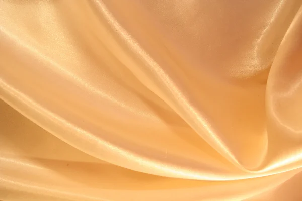 光滑优雅金色丝绸作为背景 — 图库照片