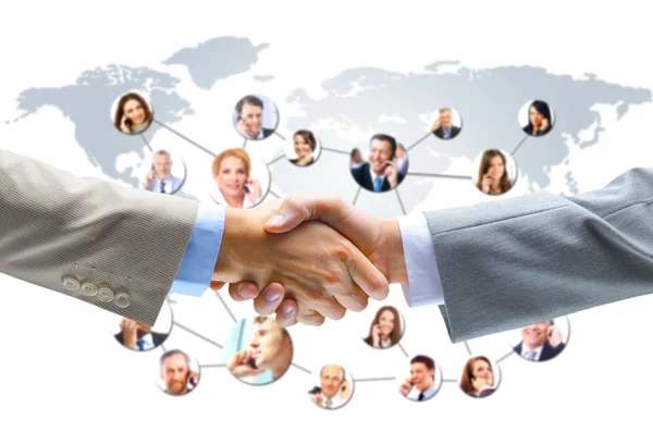 Business handslag med företaget team i bakgrunden — Stockfoto
