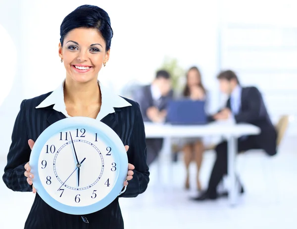 Young attractive business woman holding clock. — Stock Photo, Image