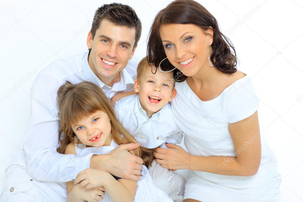 Portrait of happy family smiling at the camera