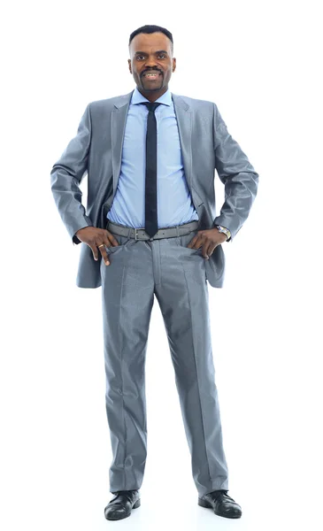 Volledige lengte portret van een gelukkig zakenman permanent tegen geïsoleerde witte achtergrond — Stockfoto