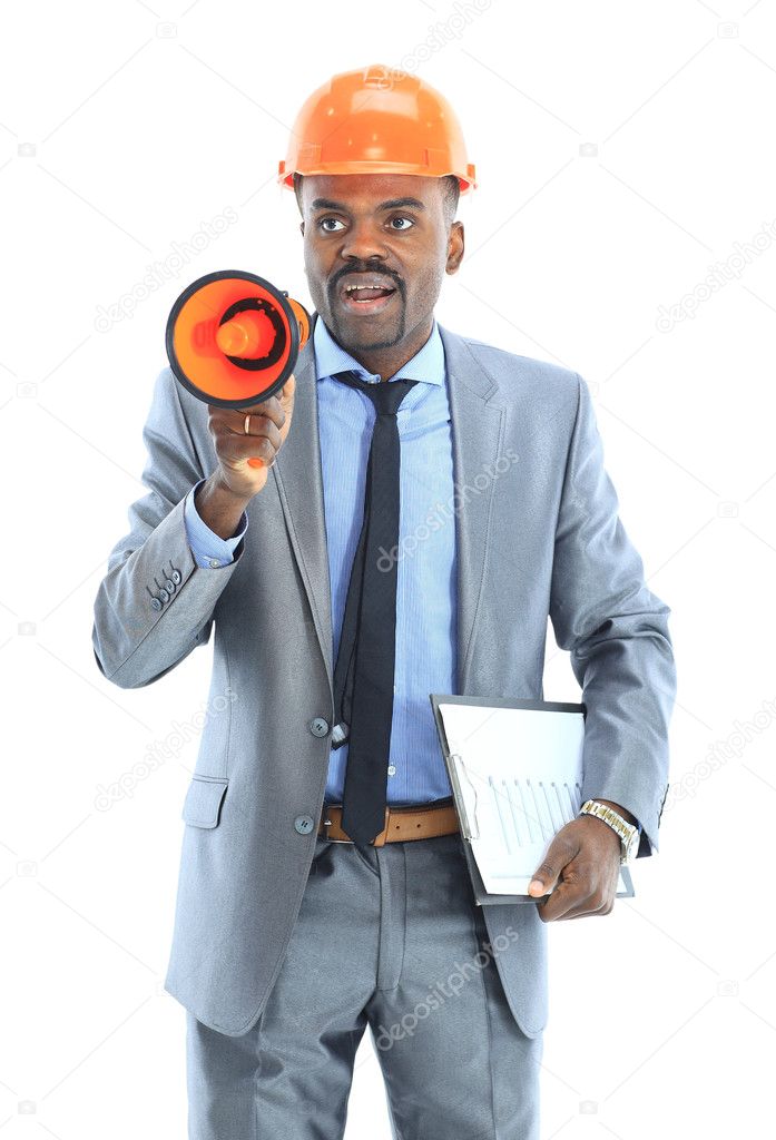 Confident ethnic architect wearing a hardhat against a white background