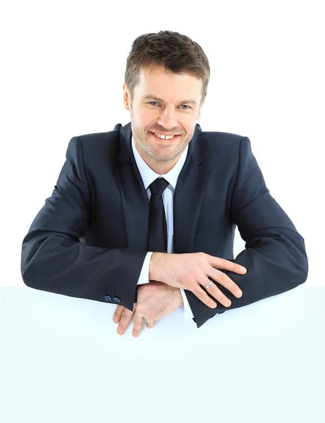 Szczęśliwy uśmiechający się człowiek biznesu wyświetlone puste szyld, na białym tle ove — Zdjęcie stockowe