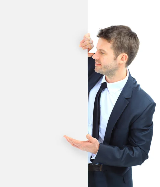 Ευτυχής χαμογελαστός άνθρωπος των επιχειρήσεων δείχνει κενό πινακίδα, απομονωμένη ΟΒΕ — Φωτογραφία Αρχείου