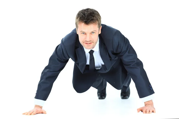 Knappe dienst zakenman doet push ups geïsoleerd op witte b — Stockfoto