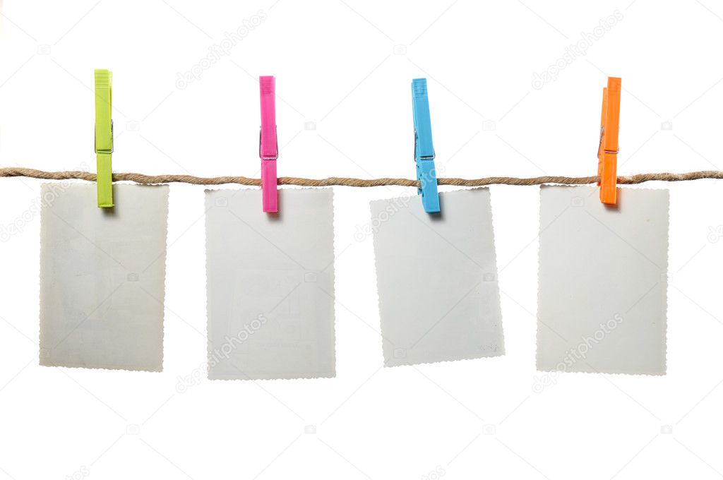 Old Blank Photos Hanging on Rope on White Background