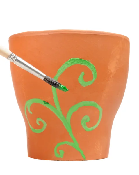 Pincel pintura ornamento em vaso de flor de barro — Fotografia de Stock