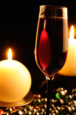 Romantic Dinner - Glass of Red Wine and Burning Candles clipart