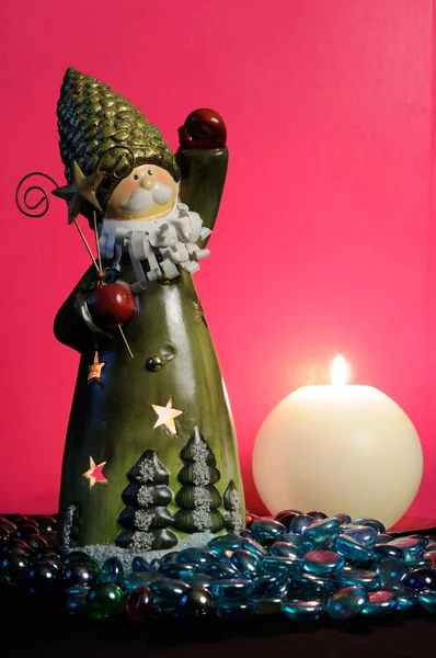 Santa Claus Candleholder and Burning Candle on Romantic Pink Background — Stock Photo, Image