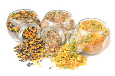 Glass Jars with Assorted Cereals (Lentils, Rice, Split Peas) Isolated on W clipart