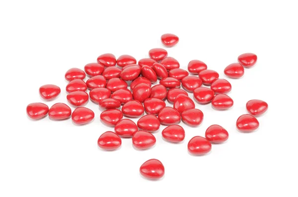 Píldoras rojas aisladas sobre fondo blanco — Foto de Stock