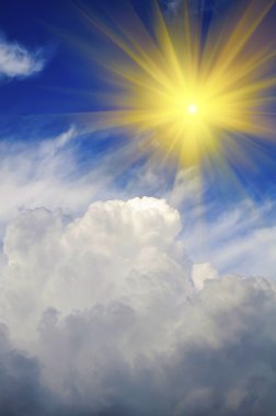 Sun Shining in Sky with Puffy Clouds clipart