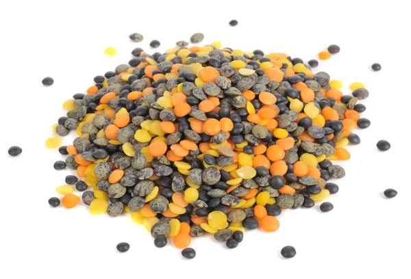 Stapel van zwart, oranje en geel linzen — Stockfoto