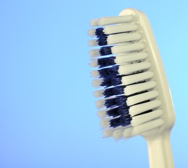 Toothbrush on Blue Background clipart