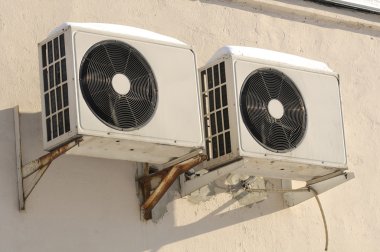 Outdoor Units of Air Conditioner on the Wall clipart