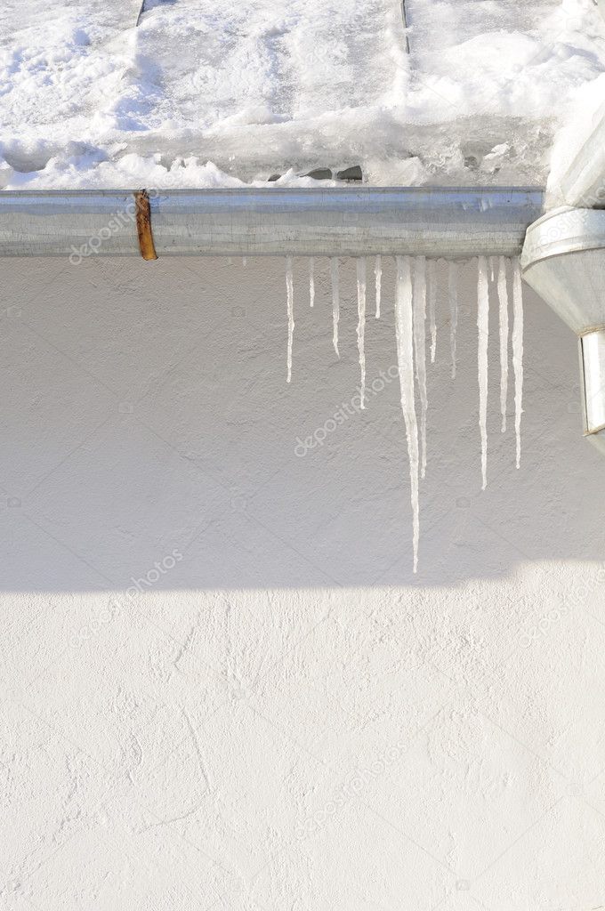 Icicles Hanging from Downspout in Winter