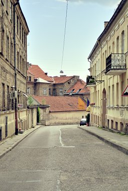 VILNIUS, LITHUANIA - 22 July 2010: A narrow street in Vilnius Old town clipart