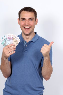 Man with money showing thumbs up clipart