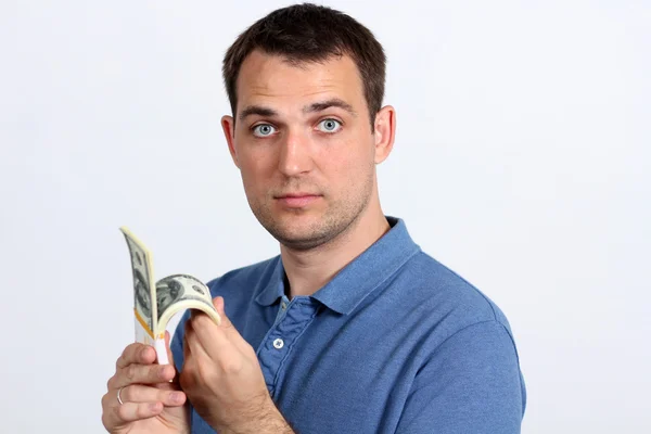 Man met geld duimen opdagen — Stockfoto