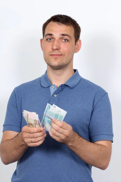 Mann mit Geld zeigt Daumen hoch — Stockfoto