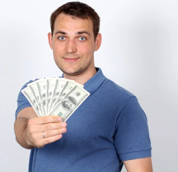 Homem com dinheiro mostrando polegares para cima — Fotografia de Stock