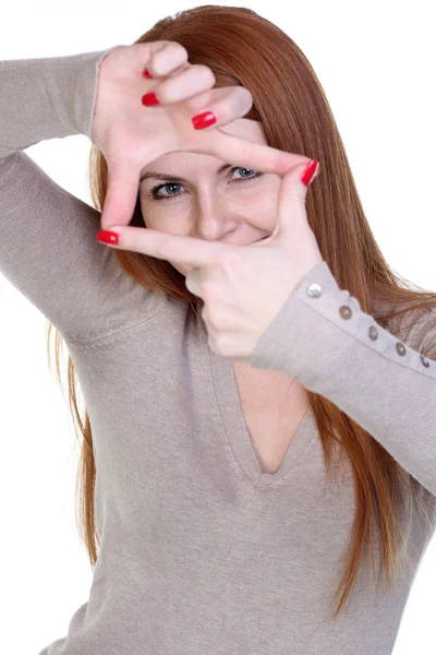 Pretty girl framing her face with her hands — Stock Photo, Image