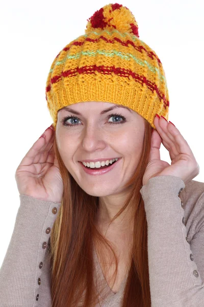 Happy woman in a knitted hat — Stock Photo, Image