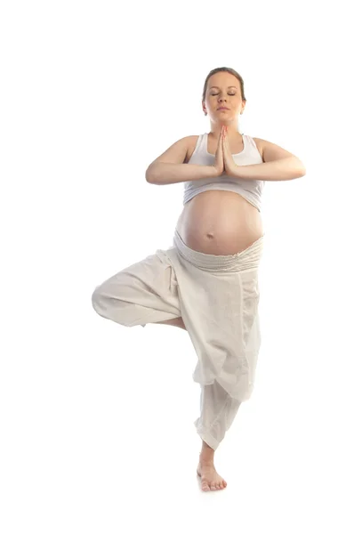 Beautiful pregnant woman doing yoga exercise. — Stock Photo, Image