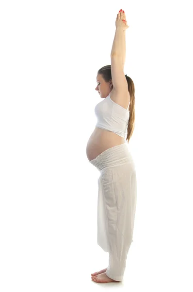 Beautiful pregnant woman doing yoga exercise. — Stock Photo, Image