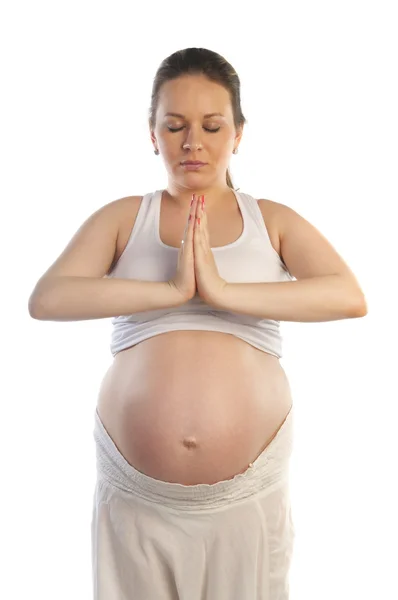 Belle femme enceinte faisant de l'exercice de yoga . — Photo