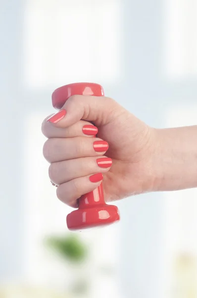 Dumbbell in woman hand — Stock Photo, Image