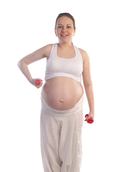 Krásná těhotná žena dělá cvičení — Stock fotografie
