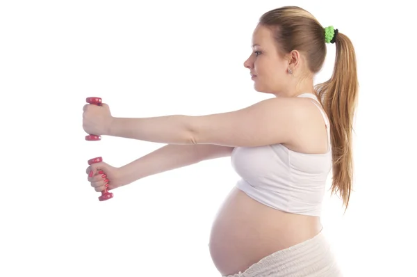 Belle femme enceinte faisant des exercices — Photo