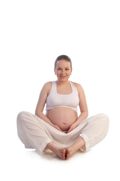Schwangere berührt ihren Bauch mit Händen — Stockfoto