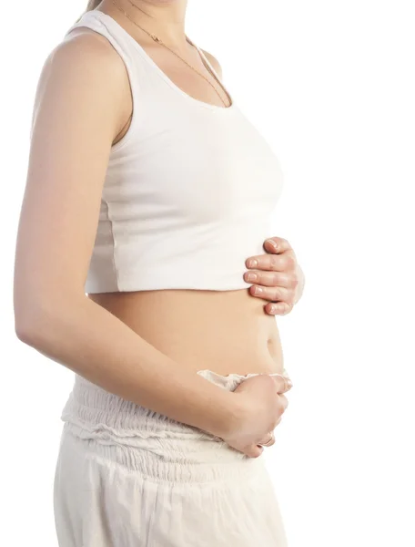 Mujer embarazada tocándose el vientre con las manos —  Fotos de Stock