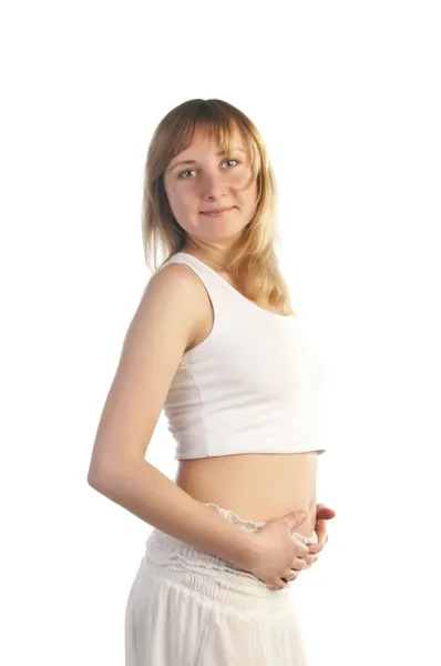 Красива вагітна на білому тлі — стокове фото