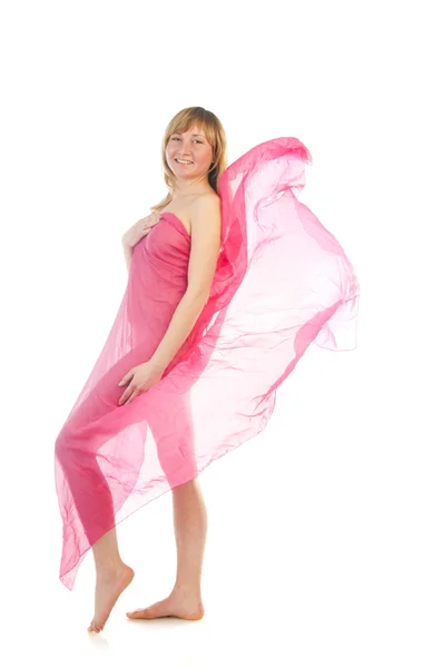 Hermosa mujer joven embarazada en vestido de soplado rosa —  Fotos de Stock