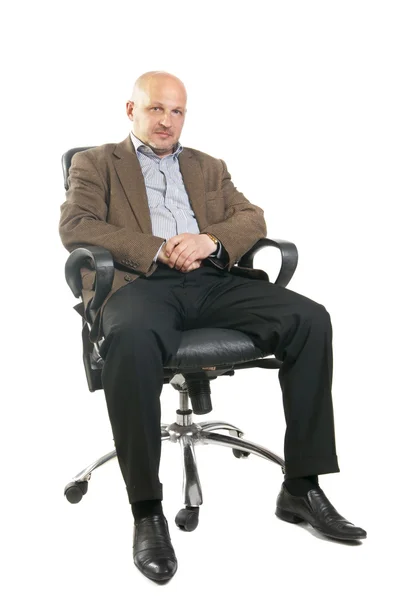 Business man sitting on a chair over white background — Stock Photo, Image